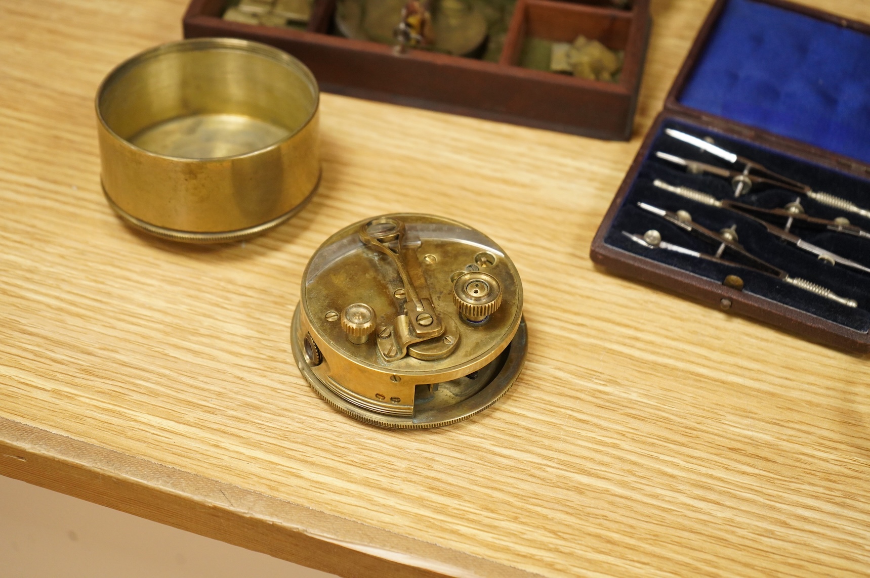 Four scientific instruments, consisting; a set of apothecaries steel balance scales, by Charles de Grave, 59, St. Martin’s le Grand…London; a set of three small drawing compasses, leather cased; a prismatic compass, by S